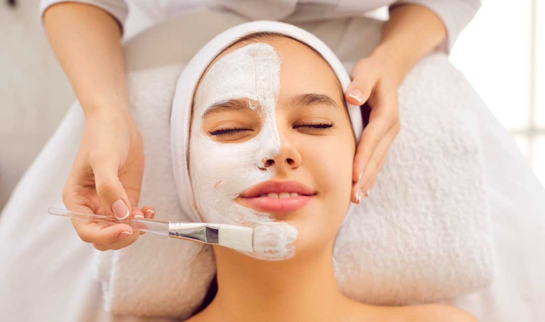 Teen getting a facial treatment